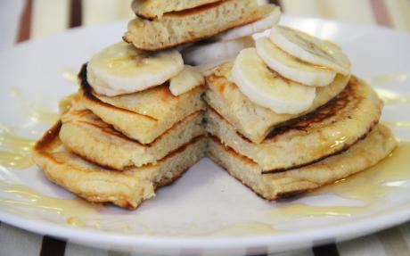 Pancake cake with sour cream and bananas